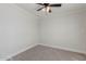 Bedroom featuring neutral carpet, baseboard trim, and a ceiling fan at 3952 E Baywood Ave, Mesa, AZ 85206