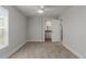 Bright bedroom featuring wood-look flooring, a ceiling fan, and an ensuite bathroom at 3952 E Baywood Ave, Mesa, AZ 85206