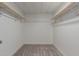 Empty walk-in closet with carpet and wooden racks for optimal storage at 3952 E Baywood Ave, Mesa, AZ 85206