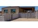 Gated driveway of single-Gathering home features security signs and decorative brickwork at 3952 E Baywood Ave, Mesa, AZ 85206