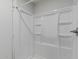 Modern bathroom shower with new fixtures and a neutral design scheme at 3952 E Baywood Ave, Mesa, AZ 85206