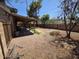 Backyard with privacy fence, patio cover, and gravel at 4112 S Grandview Ave, Tempe, AZ 85282