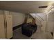 Basement area with neutral sofa, refrigerator, and staircase at 4112 S Grandview Ave, Tempe, AZ 85282