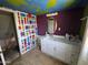 Unique bathroom features a vanity sink, colorful walls and bold decorative accents at 4112 S Grandview Ave, Tempe, AZ 85282