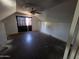 Attic bedroom featuring a ceiling fan, sloping walls, and weathered floors at 4112 S Grandview Ave, Tempe, AZ 85282