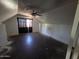 Attic bedroom featuring a ceiling fan, sloping walls, and weathered floors at 4112 S Grandview Ave, Tempe, AZ 85282