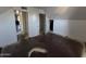 Attic bedroom featuring a closet, sloping walls, and weathered floors at 4112 S Grandview Ave, Tempe, AZ 85282