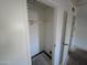 Empty walk-in closet featuring a clothes rod and weathered floor at 4112 S Grandview Ave, Tempe, AZ 85282