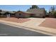 Charming single-story brick home featuring a paved driveway and low-maintenance desert landscaping at 4112 S Grandview Ave, Tempe, AZ 85282