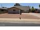 Front exterior featuring a well-kept brick home with a paved driveway and desert landscaping at 4112 S Grandview Ave, Tempe, AZ 85282