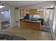 Bright kitchen layout featuring a gas cooktop, breakfast bar, and stainless steel appliances at 4112 S Grandview Ave, Tempe, AZ 85282