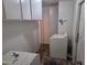 Functional laundry room with washer, dryer, and storage cabinets at 4112 S Grandview Ave, Tempe, AZ 85282