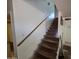 Straight staircase leading to the upper level with unfinished wood treads and simple railing at 4112 S Grandview Ave, Tempe, AZ 85282