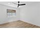 Empty bedroom featuring a ceiling fan, neutral walls, and a large window at 4842 E Surrey Ave, Scottsdale, AZ 85254