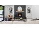 Inviting living room featuring a sleek black fireplace, stylish decor, and comfortable seating arrangement at 4842 E Surrey Ave, Scottsdale, AZ 85254