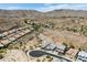 Expansive aerial view of the neighborhood and home nestled in a picturesque desert landscape at 520 E Ashurst Dr, Phoenix, AZ 85048