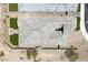 Aerial view of a home's roof with turf in the backyard and desert landscaping surrounding the property at 520 E Ashurst Dr, Phoenix, AZ 85048
