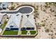 Aerial view of home with turf backyard, desert landscaping and tile roof in a desert community at 520 E Ashurst Dr, Phoenix, AZ 85048