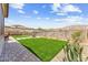 Beautiful backyard featuring a well-maintained lawn, desert landscaping, and mountain views at 520 E Ashurst Dr, Phoenix, AZ 85048