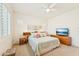 Spacious bedroom featuring a decorative headboard and neutral decor, offering a cozy retreat at 520 E Ashurst Dr, Phoenix, AZ 85048