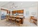 Bright eat-in kitchen features a large island with seating, stainless steel appliances, and stylish wood cabinetry at 520 E Ashurst Dr, Phoenix, AZ 85048