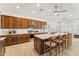 Spacious kitchen with a large island, modern appliances, wood cabinets and hardwood floors at 520 E Ashurst Dr, Phoenix, AZ 85048