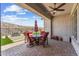 An outdoor covered patio featuring comfortable patio furniture and beautiful desert views at 520 E Ashurst Dr, Phoenix, AZ 85048