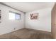 Carpeted bedroom featuring neutral walls, a window with blinds, and a closet for functional, minimalist living at 539 E Pebble Beach Dr, Tempe, AZ 85282