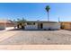 Charming single-story home featuring low-maintenance desert landscaping and a covered carport at 539 E Pebble Beach Dr, Tempe, AZ 85282