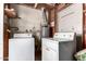 Laundry room featuring a hot water heater, a washing machine, and a dryer at 539 E Pebble Beach Dr, Tempe, AZ 85282