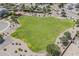 Aerial view of a landscaped green space within a residential community, great for outdoor activities at 549 E Quentin Ln, San Tan Valley, AZ 85140