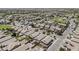 This aerial shot shows the layout of a residential area with manicured landscaping and green spaces at 549 E Quentin Ln, San Tan Valley, AZ 85140