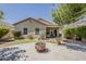 Enjoy the outdoor living space with a fire pit and covered patio in this home's backyard at 549 E Quentin Ln, San Tan Valley, AZ 85140