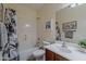 Bright bathroom featuring a shower-tub combo, neutral color palette, and vanity with sink at 549 E Quentin Ln, San Tan Valley, AZ 85140