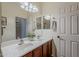 Bright bathroom featuring double sinks, a large mirror, and neutral wall colors at 549 E Quentin Ln, San Tan Valley, AZ 85140