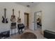 Unique bedroom featuring decorative instruments and a repurposed cable spool table at 549 E Quentin Ln, San Tan Valley, AZ 85140