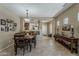Inviting dining room with stylish decor, tile flooring, and views into the kitchen at 549 E Quentin Ln, San Tan Valley, AZ 85140