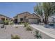 Charming single-story home with well-maintained landscaping and a spacious driveway at 549 E Quentin Ln, San Tan Valley, AZ 85140