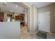 Inviting foyer with neutral tones, tiled floor, and view of the kitchen at 549 E Quentin Ln, San Tan Valley, AZ 85140