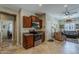 Well-lit kitchen featuring wooden cabinets, stainless steel appliances, and tiled floors at 549 E Quentin Ln, San Tan Valley, AZ 85140