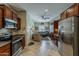 Open floor plan with kitchen, living area, tile flooring, and stainless steel appliances at 549 E Quentin Ln, San Tan Valley, AZ 85140