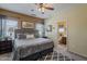 Comfortable bedroom with en-suite bathroom, decorative accents, and natural light at 549 E Quentin Ln, San Tan Valley, AZ 85140