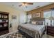 Spacious main bedroom with neutral tones, ceiling fan, and carpet flooring at 549 E Quentin Ln, San Tan Valley, AZ 85140