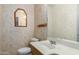 Cozy bathroom with a pedestal sink and floral wallpaper at 6009 W Medlock Dr, Glendale, AZ 85301