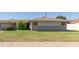 Charming single-story home features a well-maintained lawn and a classic desert landscape at 6009 W Medlock Dr, Glendale, AZ 85301