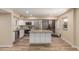 Modern kitchen featuring white cabinets, stainless steel appliances, and a center island at 6009 W Medlock Dr, Glendale, AZ 85301