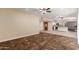 Bright and airy living room boasts a seamless flow with the adjacent open-concept kitchen at 6009 W Medlock Dr, Glendale, AZ 85301