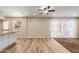 Open living space with hardwood floors seamlessly connects the kitchen and living area at 6009 W Medlock Dr, Glendale, AZ 85301
