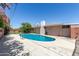 Lush landscaped yard featuring a sparkling in-ground pool at 6009 W Medlock Dr, Glendale, AZ 85301
