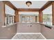 Open bar area featuring a granite countertop and decorative wood trim at 6217 W Orange Dr, Glendale, AZ 85301